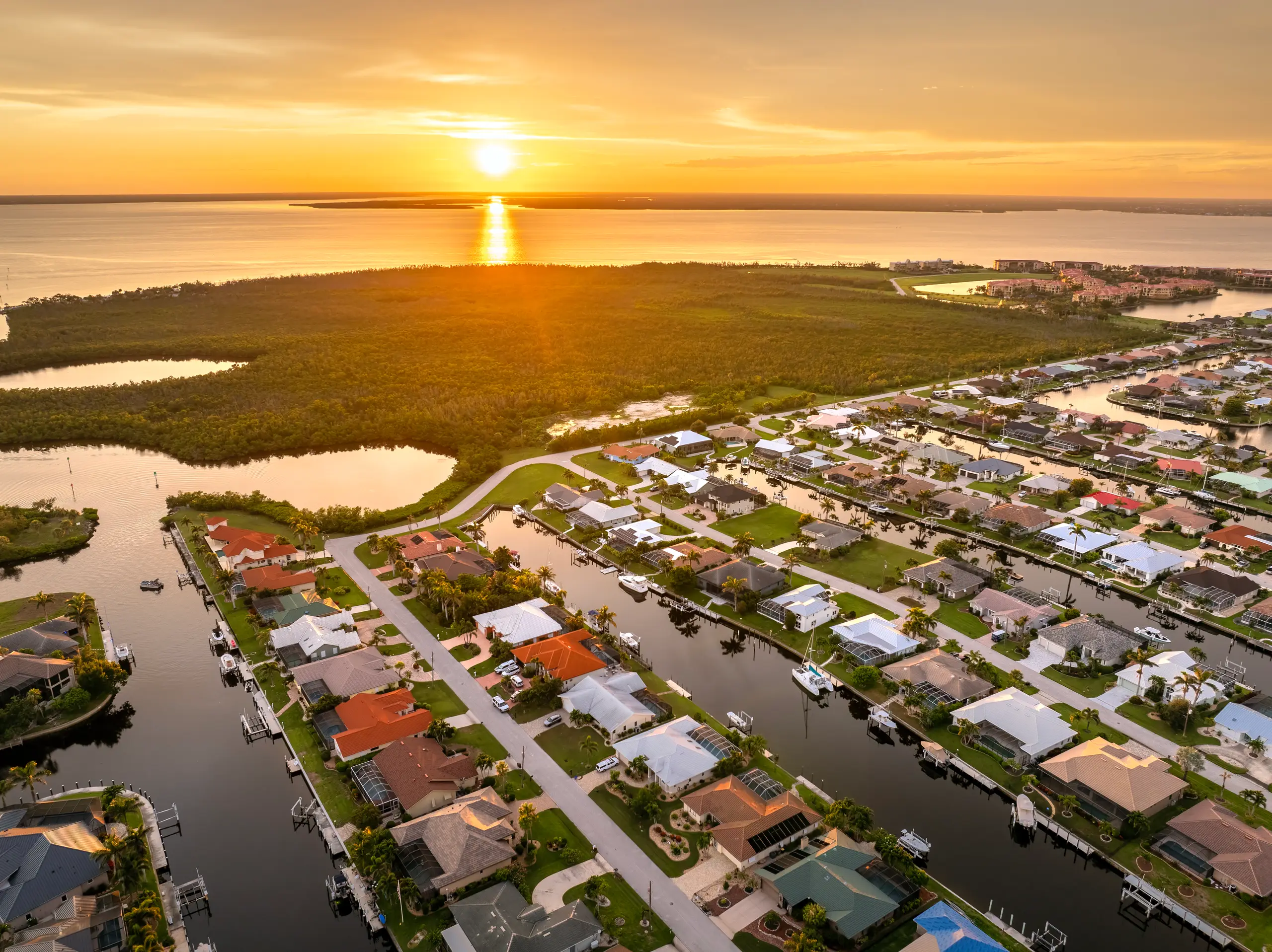 Sunset over canal-front waterfront homes in Florida